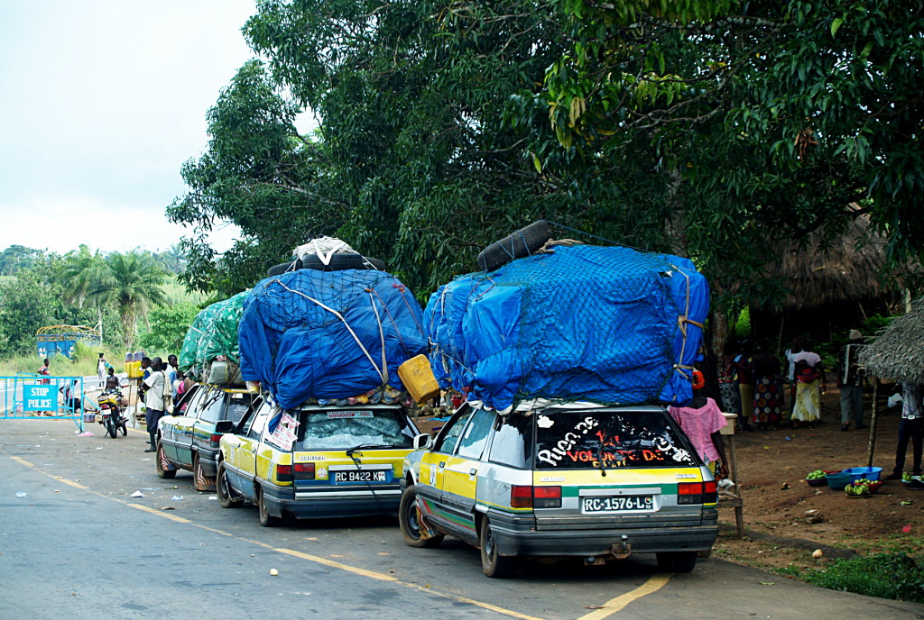 (NOT) travelling light . . . bush taxis plying the road between Guinea and Sierra Leone