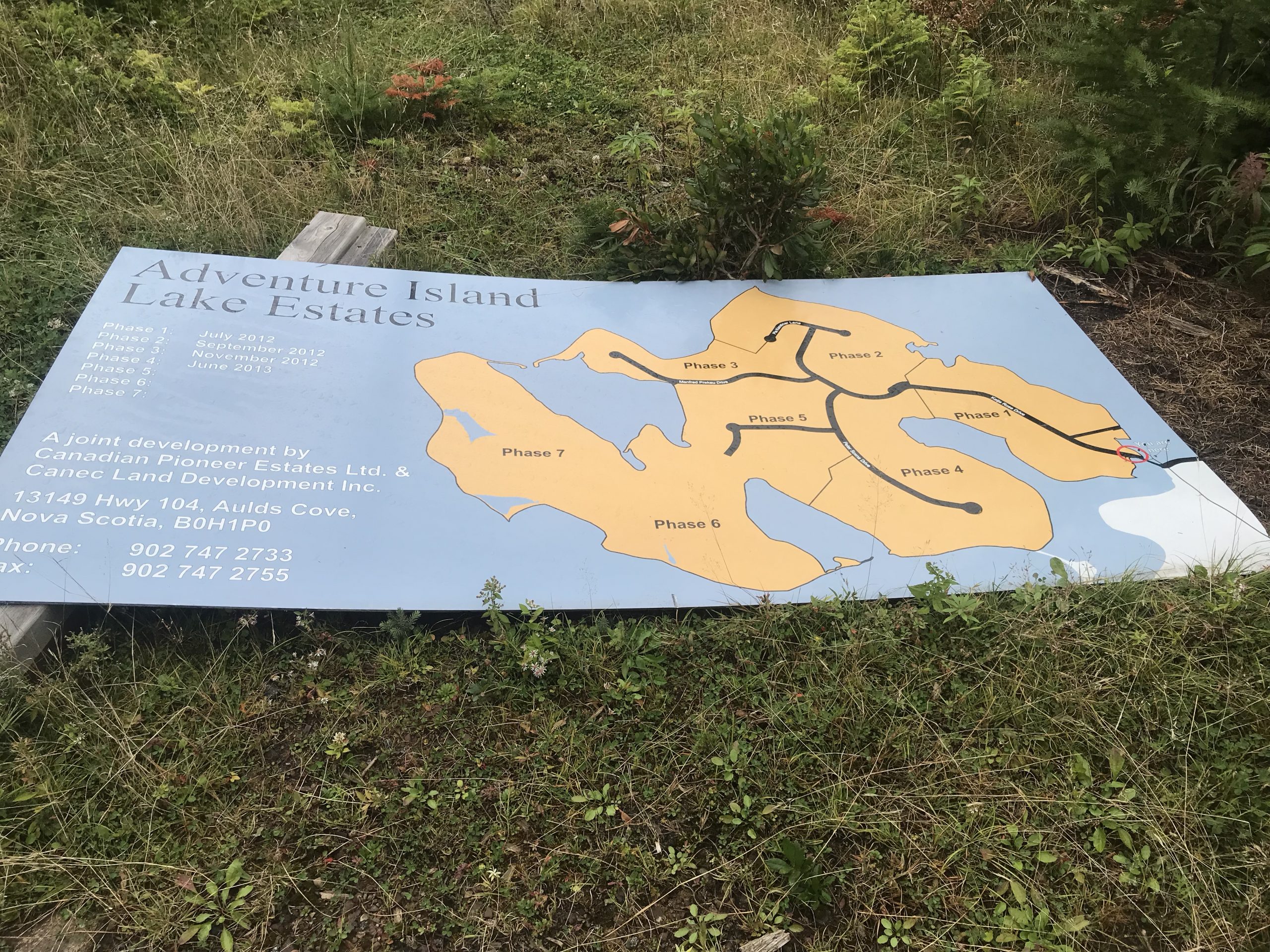 This photo shows a fallen-down signboard for the Evans Island development plan. Photo by Joan Baxter