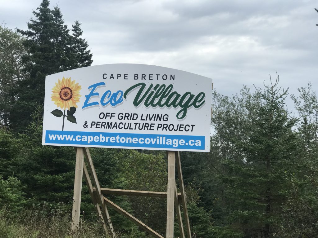 This photo shows the billboard for Frank Eckhardt's "Eco-village" with "off-grid living & permaculture project." Photo by Joan Baxter