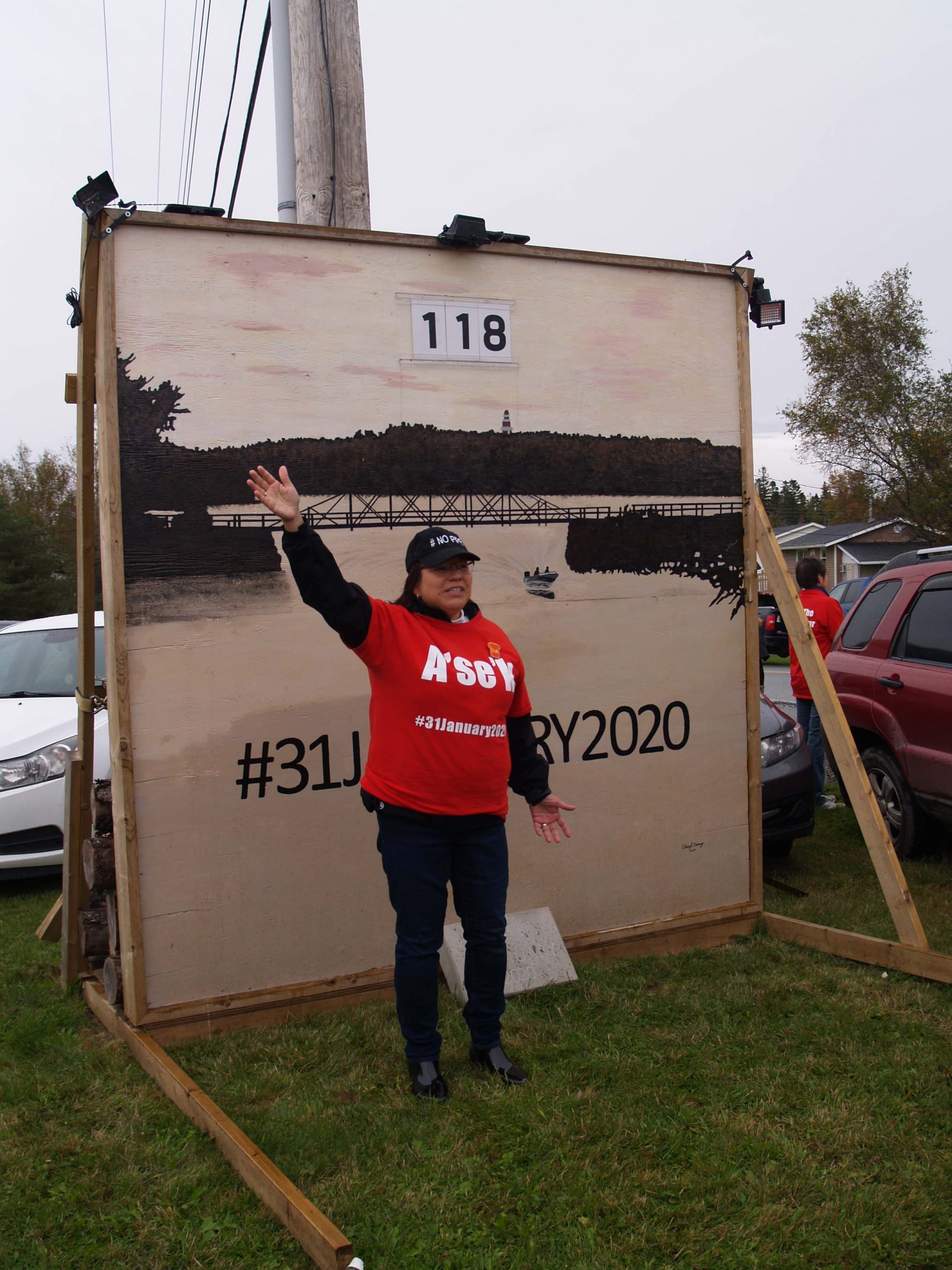 Pictou Landing First Nation Chief Andrea Paul in 2019, in front of the sign counting down the days until the legislated closure of Boat Harbour. Photo: Joan Baxter